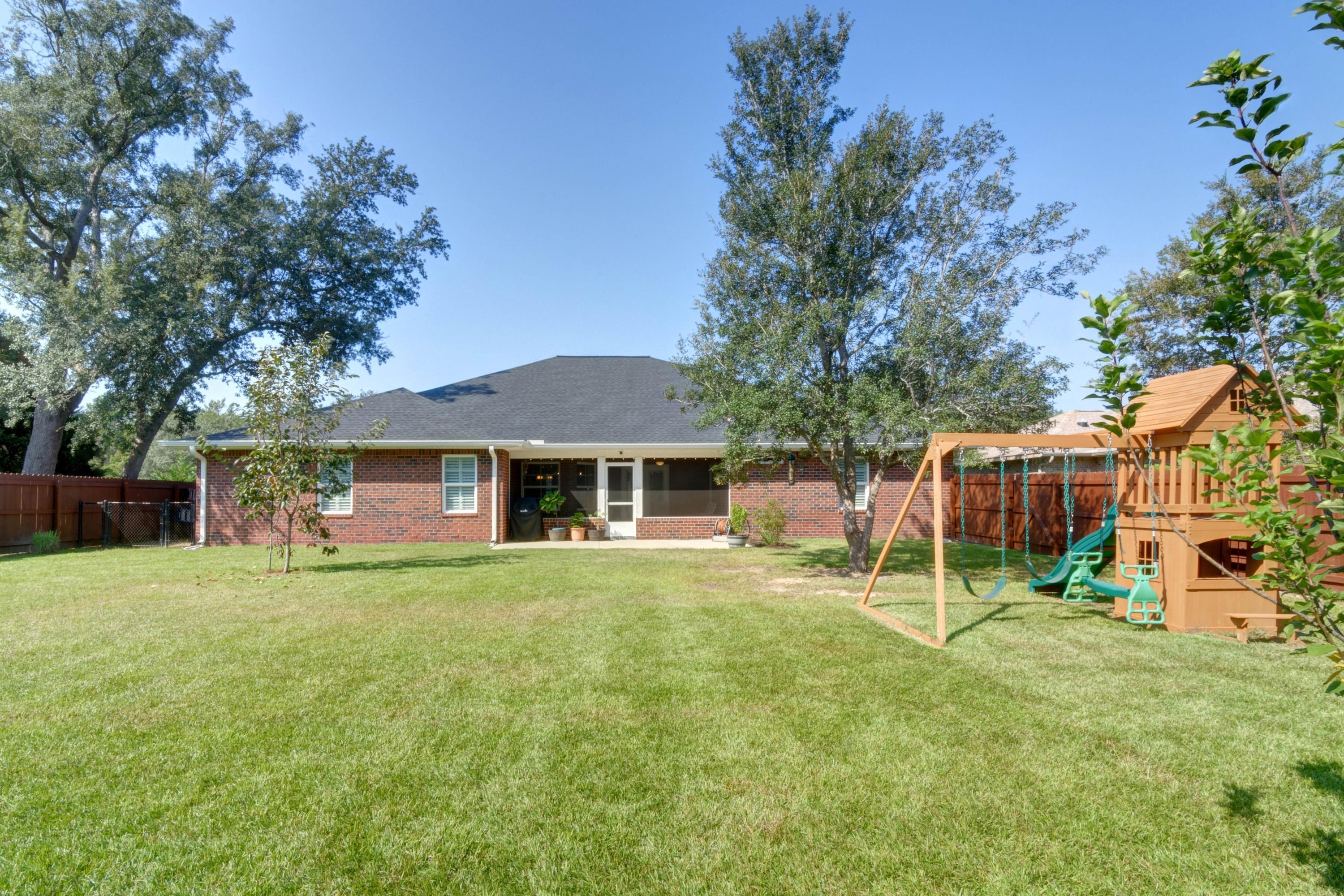 2592 Crescent Road Navarre, FL 32566 - Photo 55 of 67 front view of a house with a yard