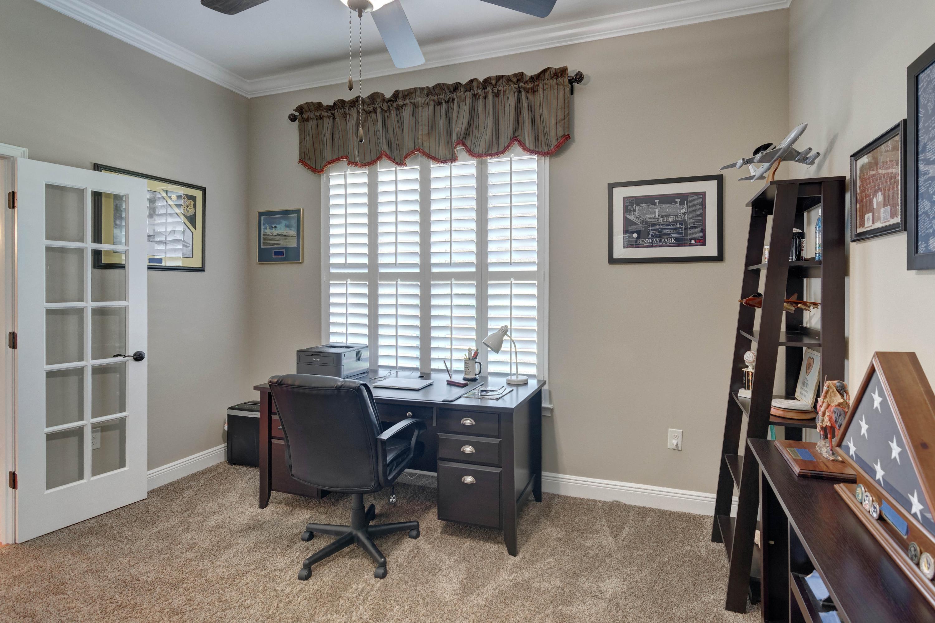 2592 Crescent Road Navarre, FL 32566 - Photo 6 of 67 a view of a workspace with furniture and a window