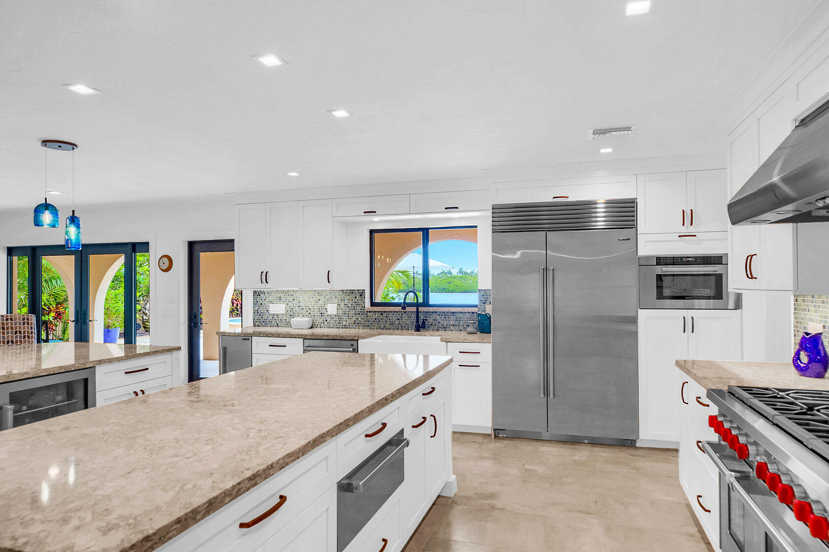 153 Key Haven Road Key West, FL 33040 - Photo 15 of 28 a kitchen with stainless steel appliances granite countertop a sink stove and refrigerator