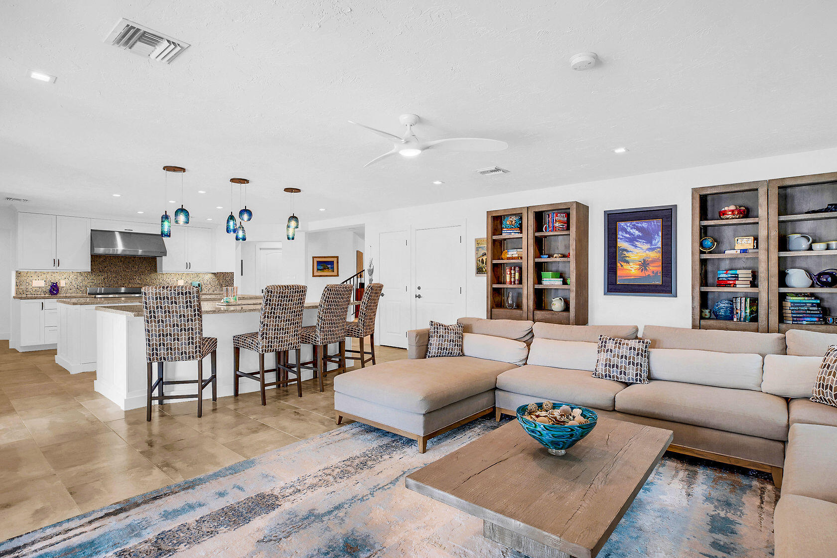 153 Key Haven Road Key West, FL 33040 - Photo 17 of 28 a living room with furniture kitchen view and a rug
