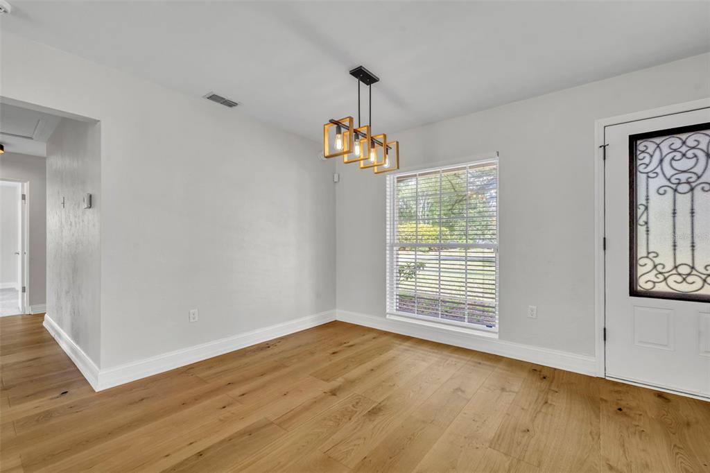 4234 Kendrick Road Orlando, FL 32804 - Photo 9 of 46 a view of empty room with wooden floor and fan