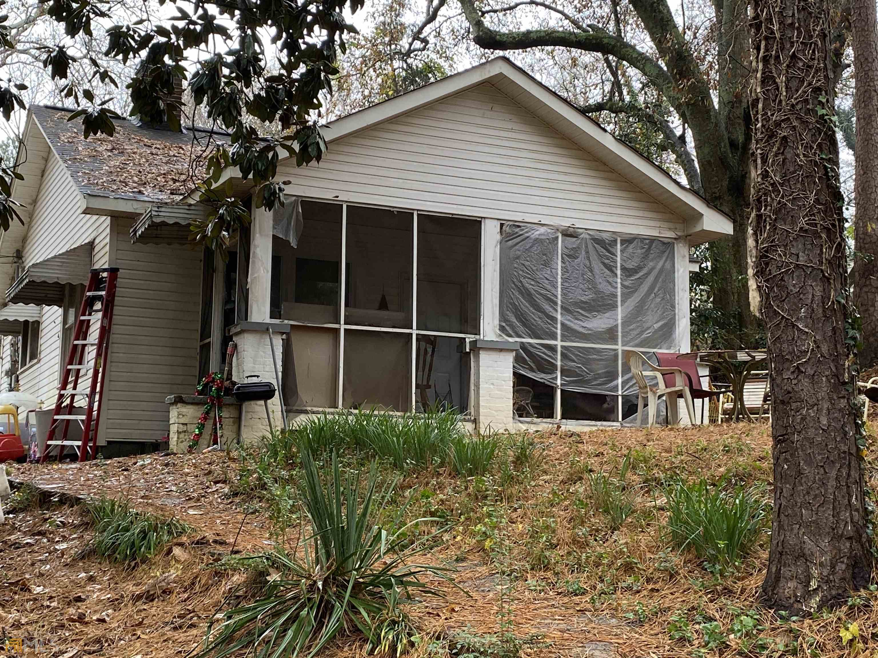 214 Stonewall Street Rome, GA 30161 - Photo 1 of 1 a view of a house with a large window and wooden fence