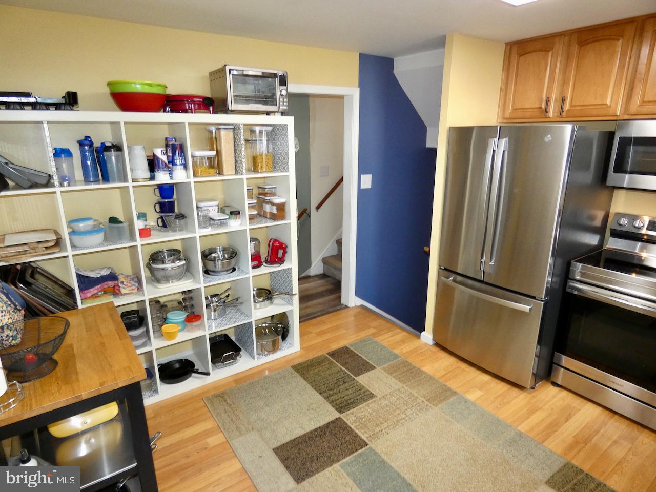 23 Upland Court Newark, DE 19713 - Photo 18 of 84 a view of a kitchen with fridge and rack
