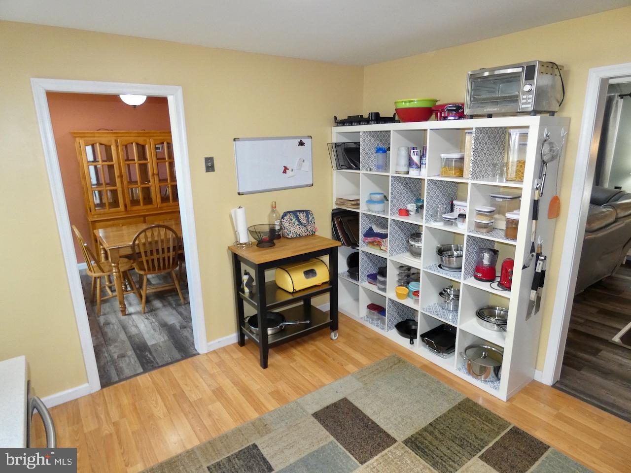 23 Upland Court Newark, DE 19713 - Photo 19 of 84 a room with furniture a rug and a book shelf