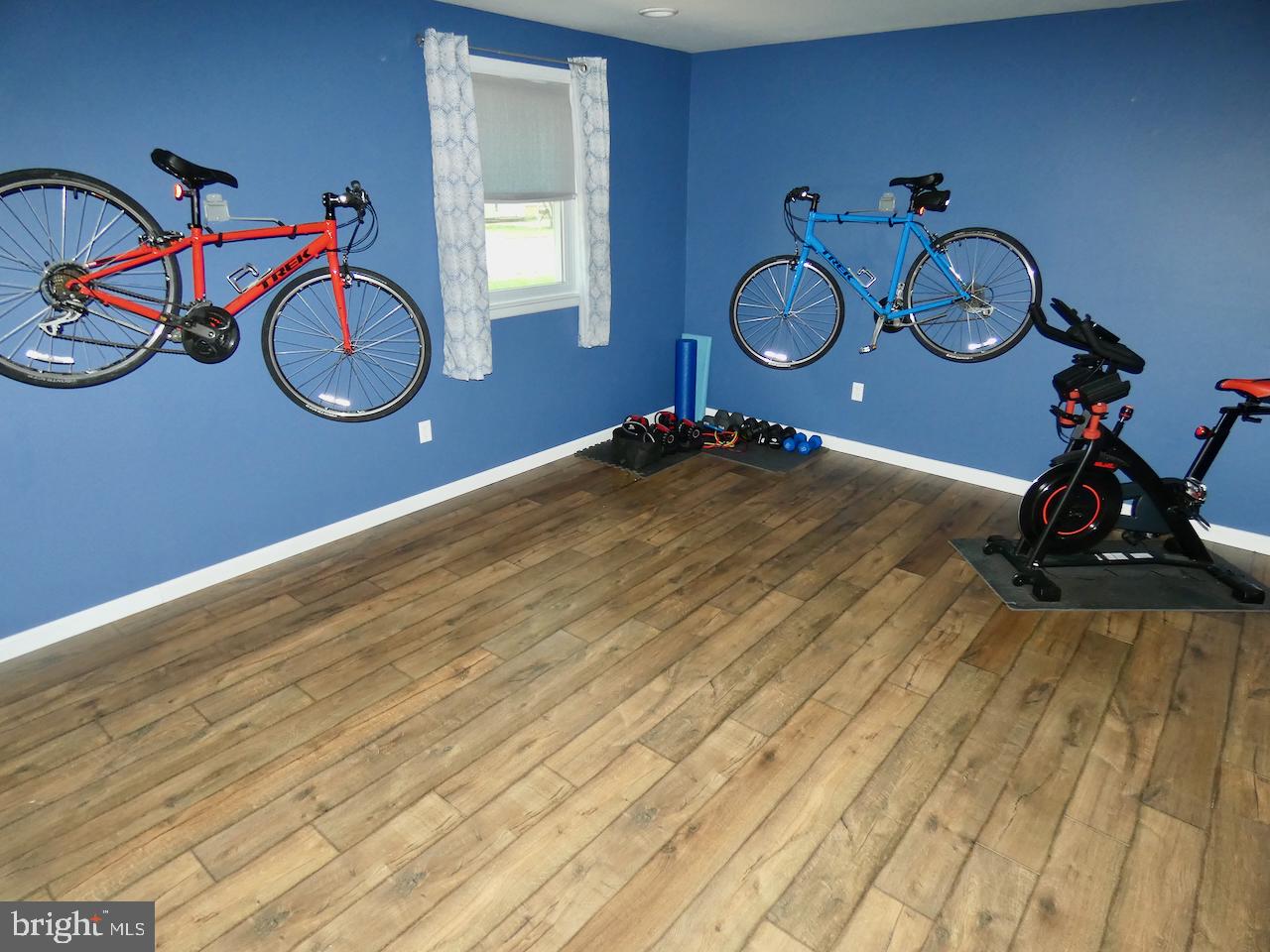 23 Upland Court Newark, DE 19713 - Photo 24 of 84 a view of a room with wooden floor and glass door
