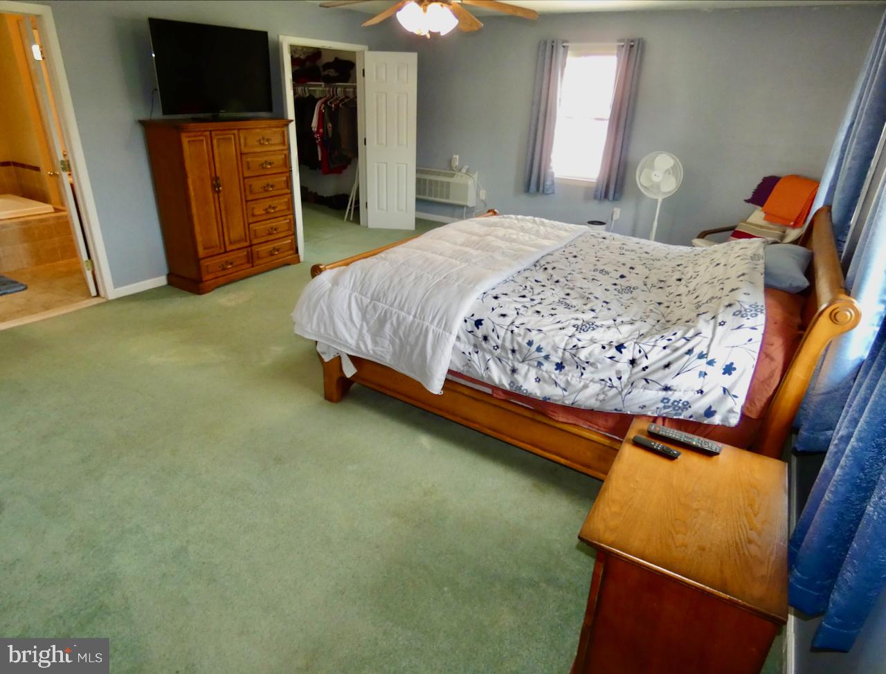 23 Upland Court Newark, DE 19713 - Photo 32 of 84 a bedroom with a bed and a television on dresser