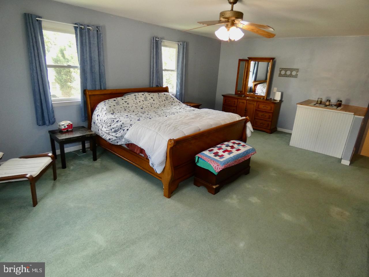 23 Upland Court Newark, DE 19713 - Photo 35 of 84 a bedroom with a bed and a chandelier