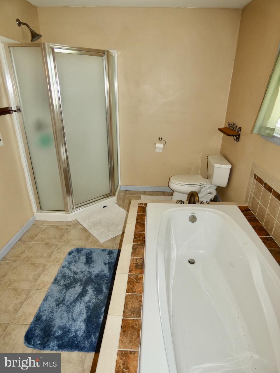23 Upland Court Newark, DE 19713 - Photo 37 of 84 a bedroom with a bed and wooden floor