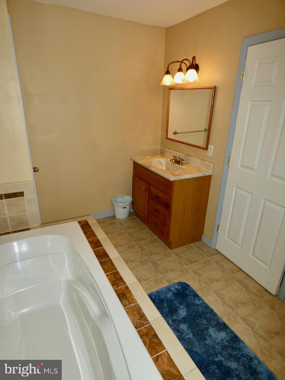 23 Upland Court Newark, DE 19713 - Photo 38 of 84 a bathroom with a sink and mirror