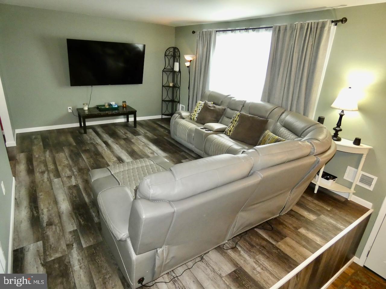 23 Upland Court Newark, DE 19713 - Photo 4 of 84 a living room with furniture and a flat screen tv