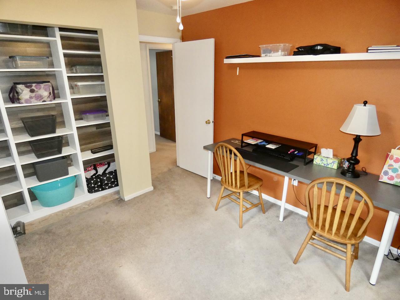 23 Upland Court Newark, DE 19713 - Photo 49 of 84 a view of a room with shelves and wooden floor