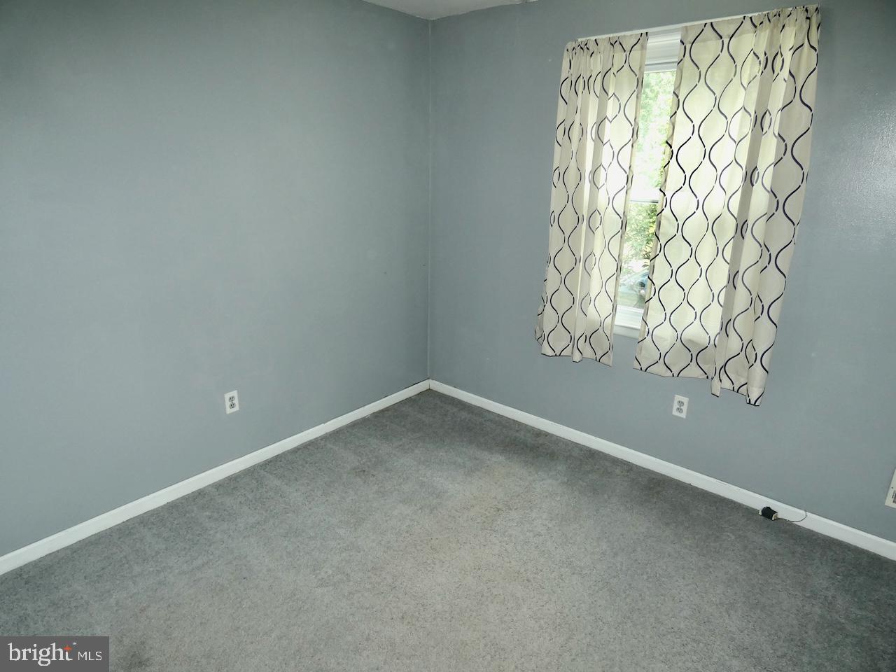 23 Upland Court Newark, DE 19713 - Photo 51 of 84 a view of an empty room and window