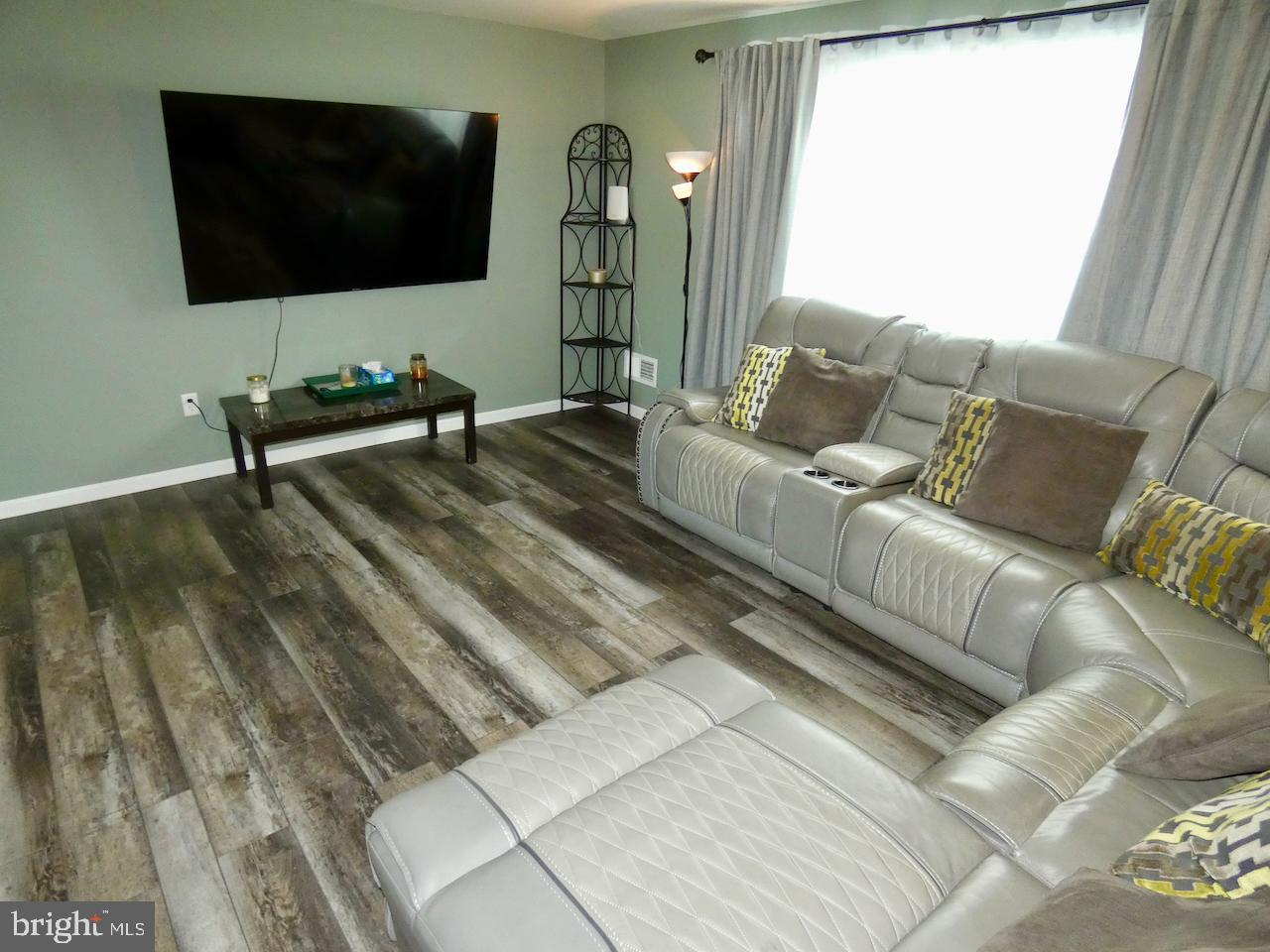 23 Upland Court Newark, DE 19713 - Photo 7 of 84 a living room with couches and a flat screen tv
