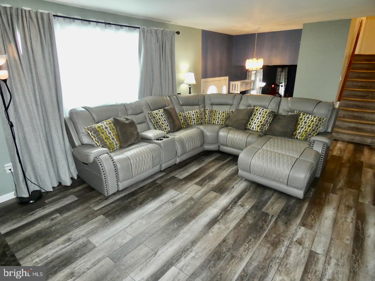 23 Upland Court Newark, DE 19713 - Photo 8 of 84 a living room with furniture and a fireplace