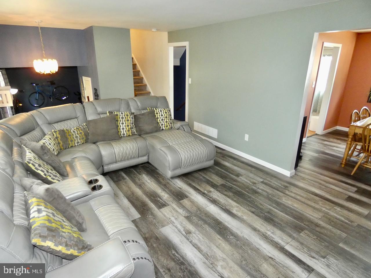 23 Upland Court Newark, DE 19713 - Photo 10 of 84 a living room with furniture and a flat screen tv