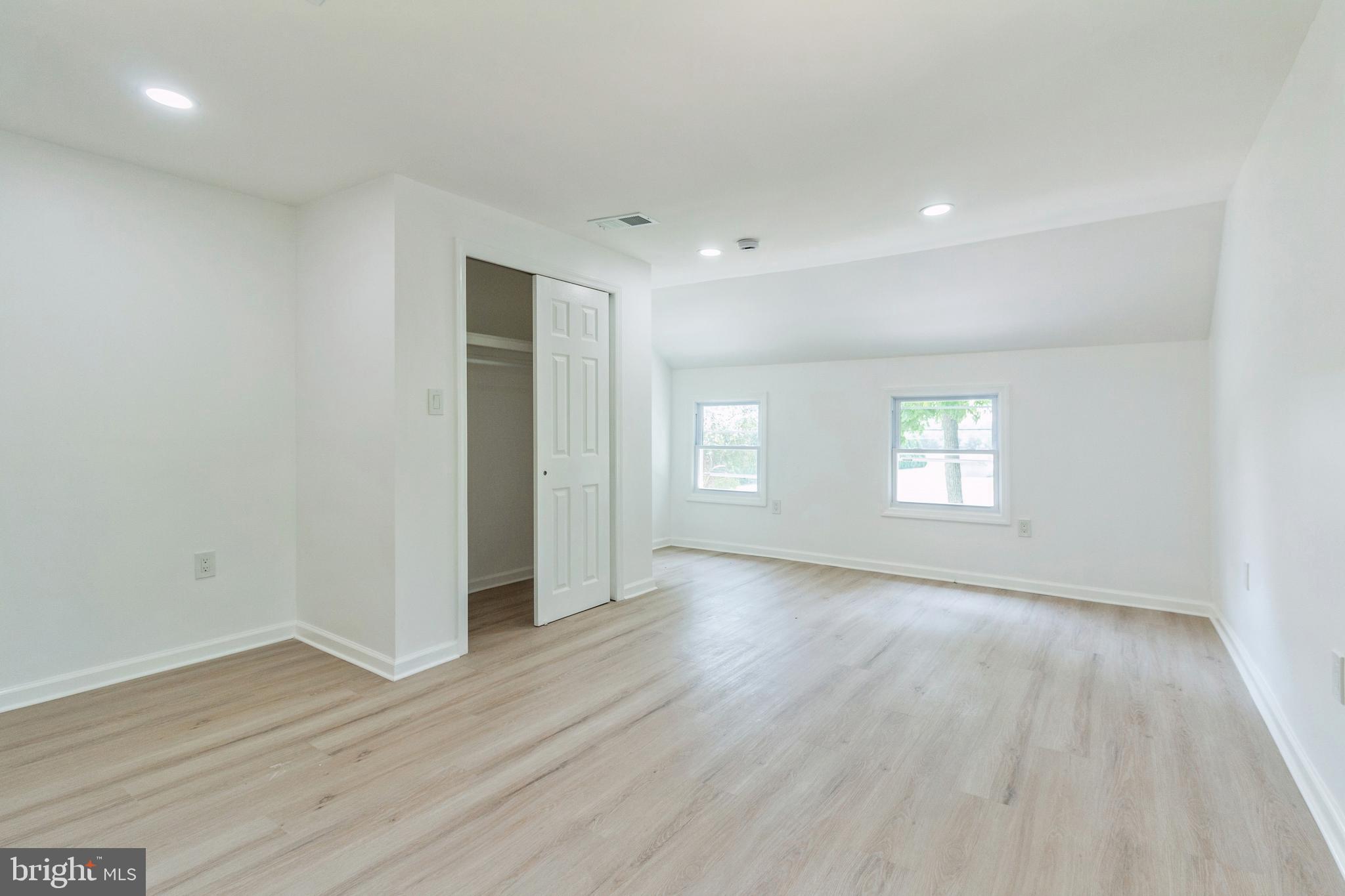 229 Shoemaker Road Bridgeton, NJ 08302 - Photo 12 of 29 an empty room with wooden floor and window