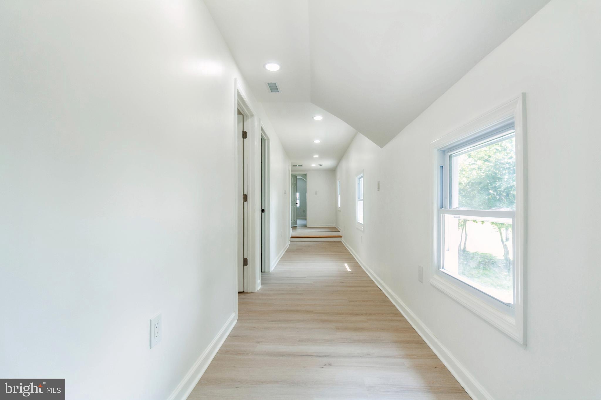 229 Shoemaker Road Bridgeton, NJ 08302 - Photo 14 of 29 a view of a hallway with wooden floor and windows