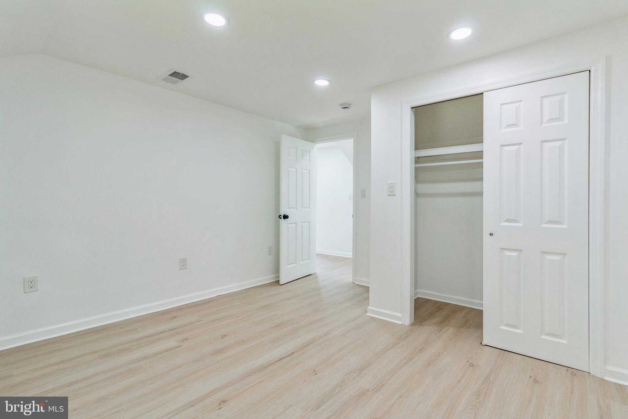 229 Shoemaker Road Bridgeton, NJ 08302 - Photo 16 of 29 an empty room with wooden floor & closet area
