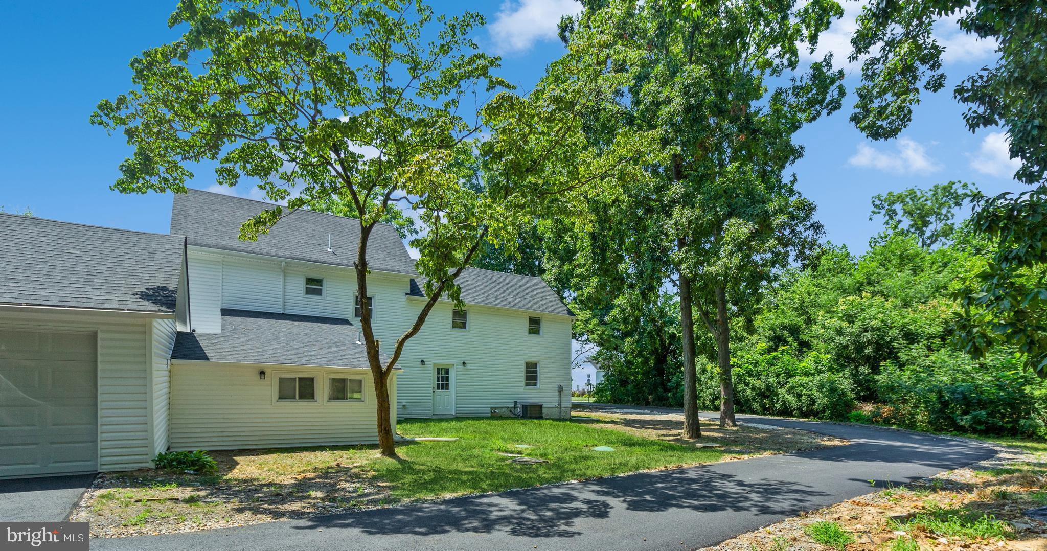 229 Shoemaker Road Bridgeton, NJ 08302 - Photo 28 of 29 a front view of a house with a yard and garage