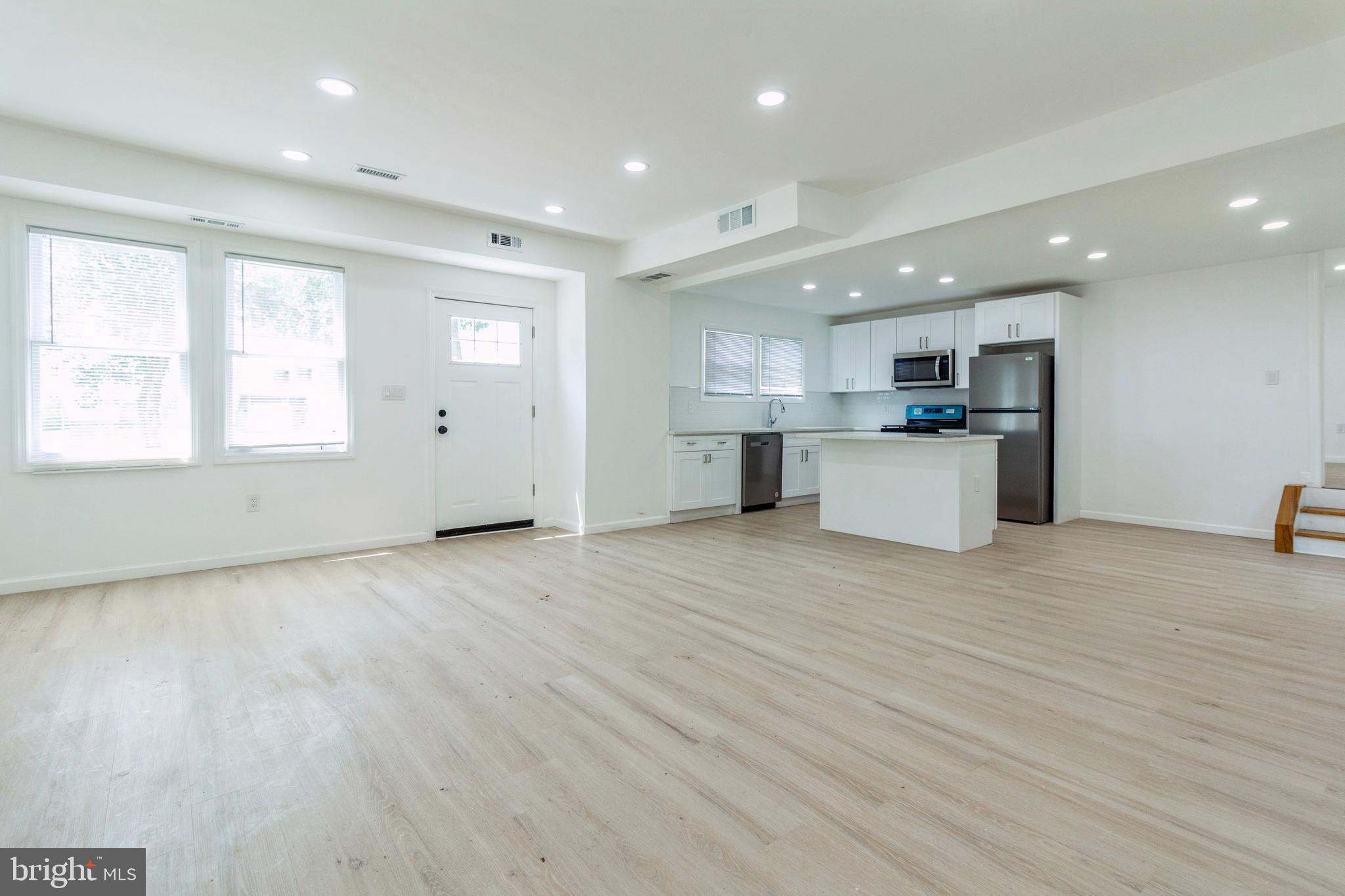 229 Shoemaker Road Bridgeton, NJ 08302 - Photo 3 of 29 a view of a kitchen with a sink and a large window