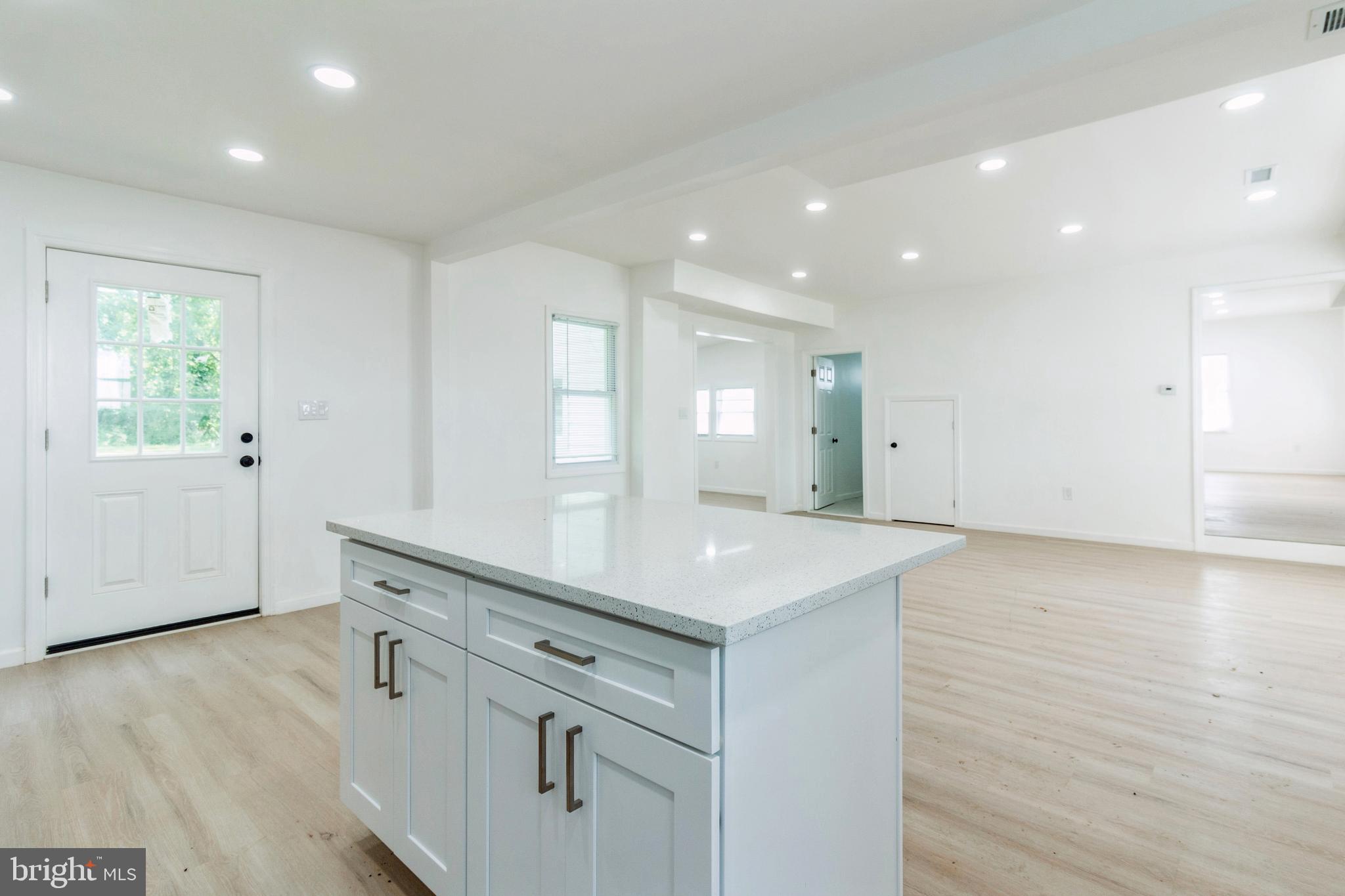 229 Shoemaker Road Bridgeton, NJ 08302 - Photo 4 of 29 a view of cabinets with wooden floor