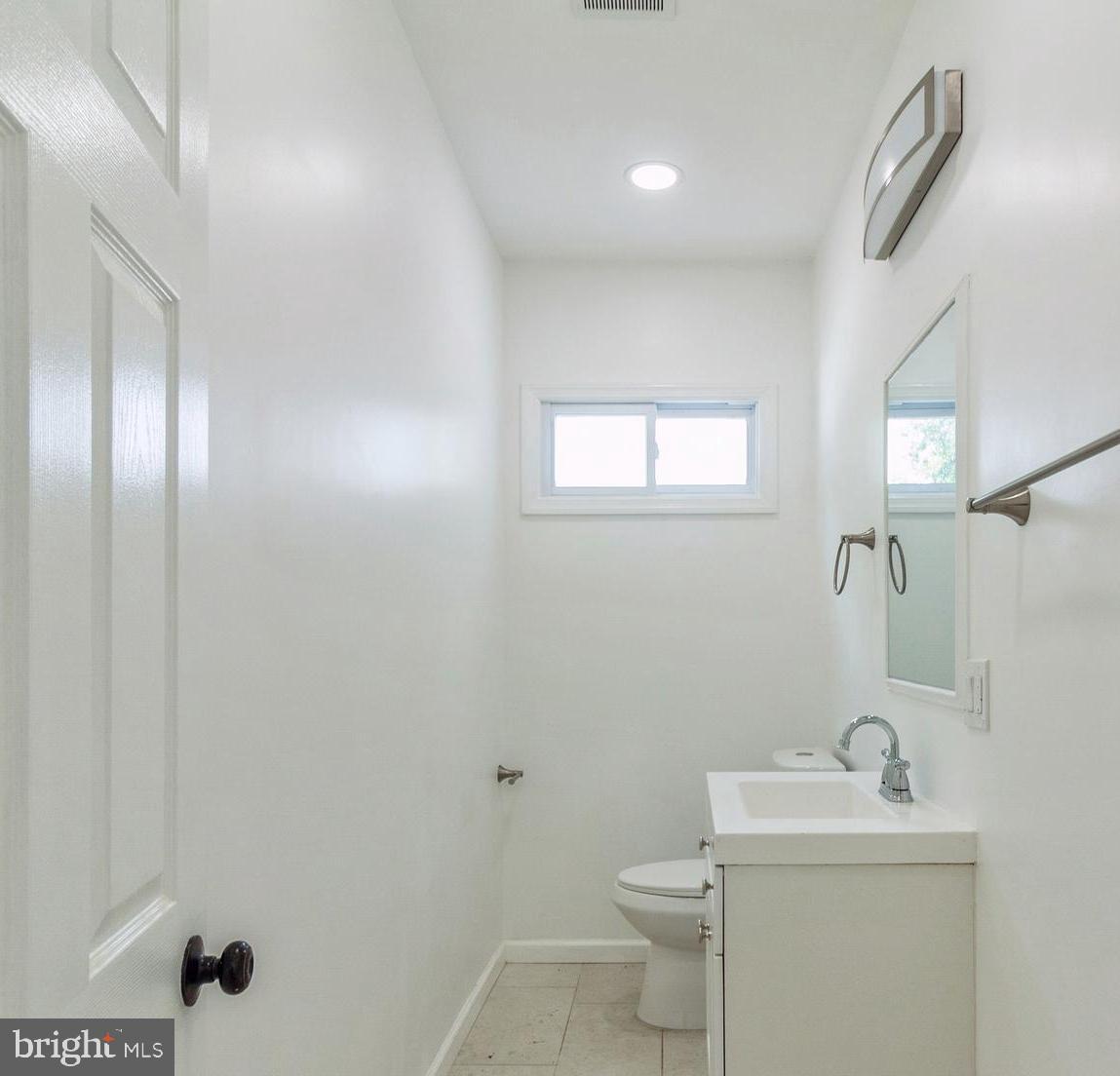 229 Shoemaker Road Bridgeton, NJ 08302 - Photo 6 of 29 a bathroom with a sink toilet and mirror