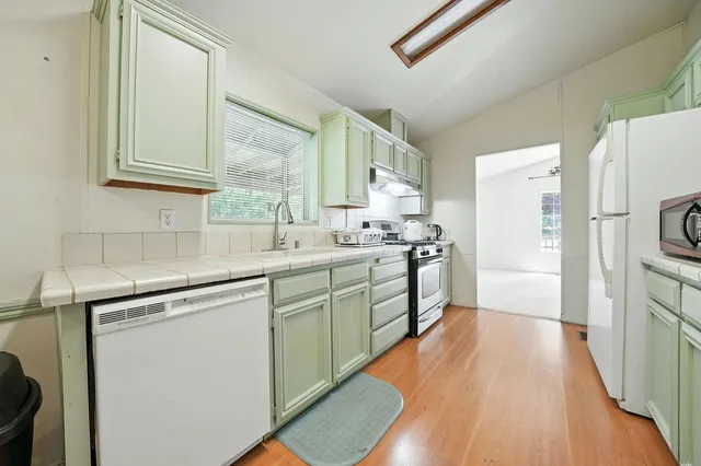 an empty room with a ceiling fan and a fan