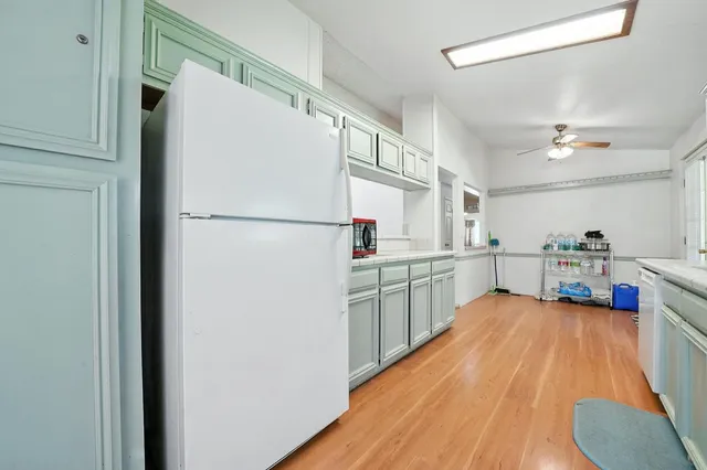 a view of a wooden house with a small yard