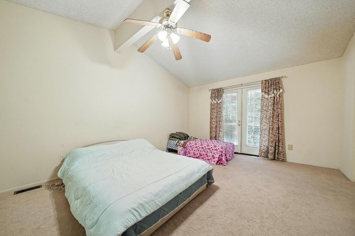16000 Sutter Creek Road Sutter Creek, CA 95685 - Photo 22 of 80 a bedroom with a bed dresser and a window