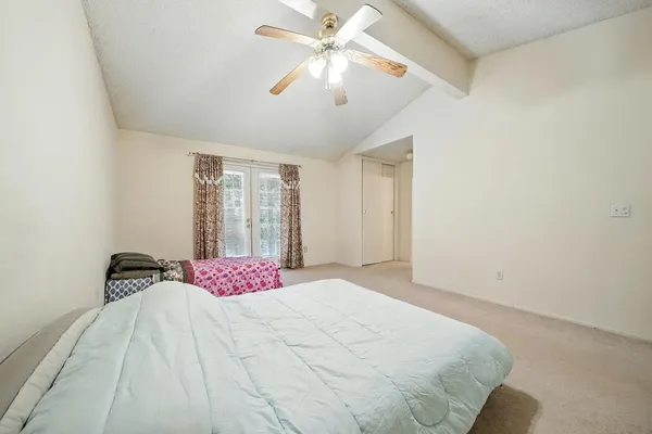 a view of a house with a wooden deck