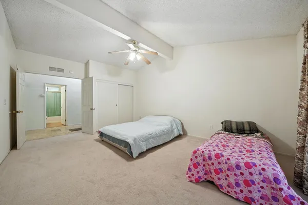 a view of a house with wooden fence