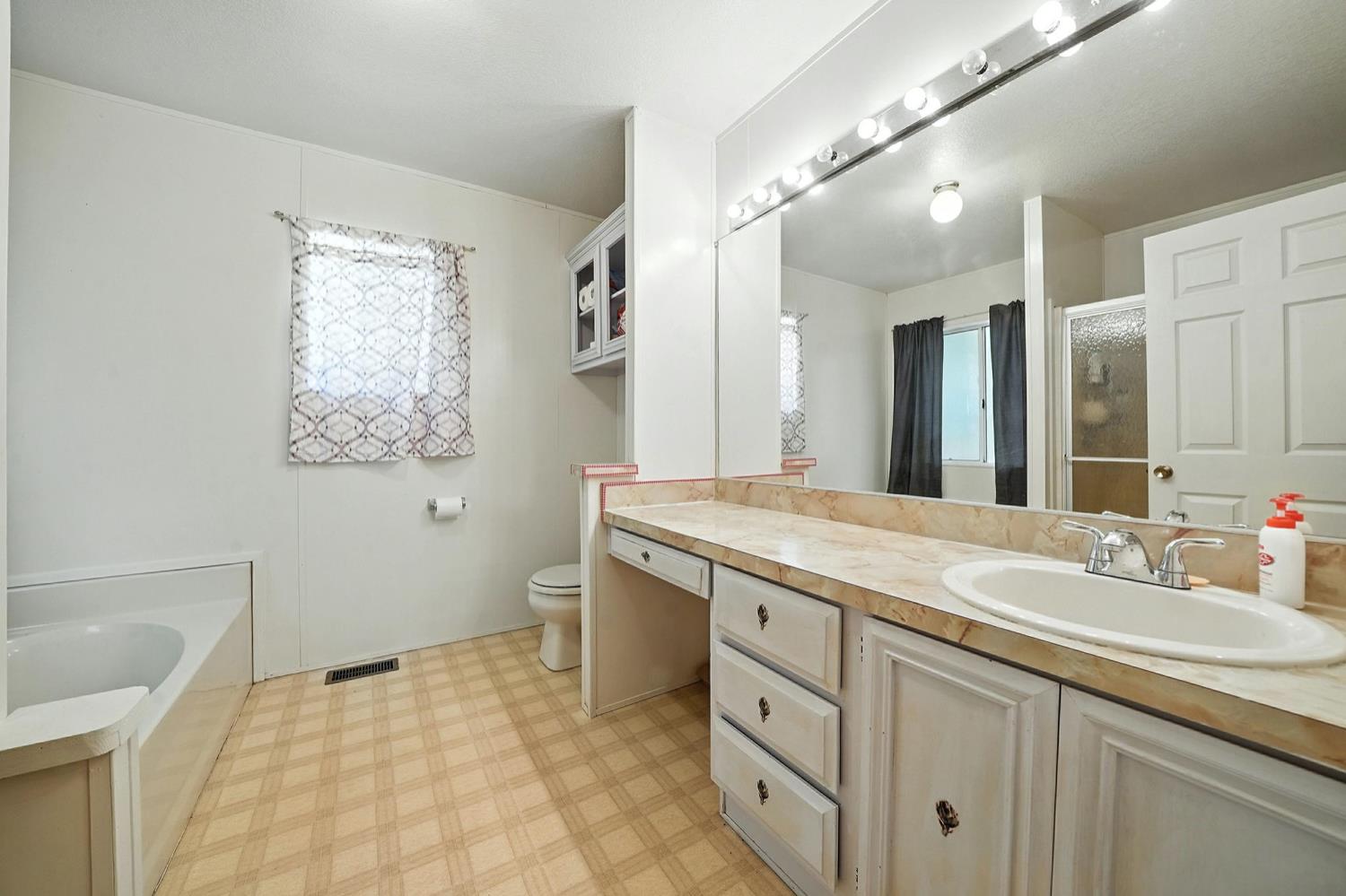 16000 Sutter Creek Road Sutter Creek, CA 95685 - Photo 25 of 80 a bathroom with a sink and a mirror