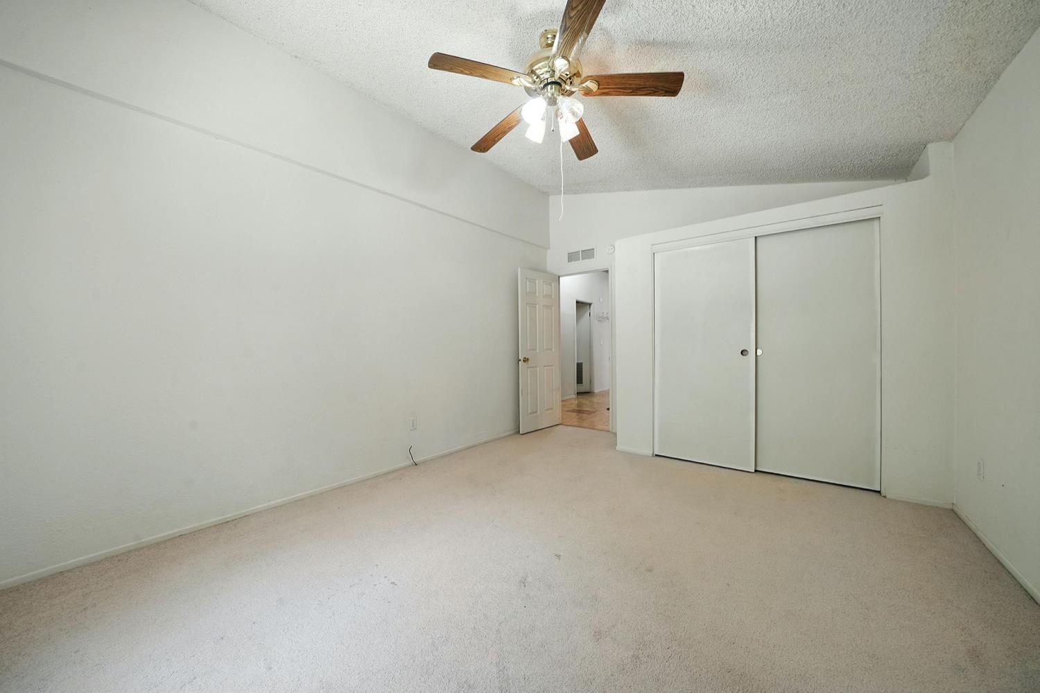 16000 Sutter Creek Road Sutter Creek, CA 95685 - Photo 28 of 80 an empty room with a ceiling fan and a fan