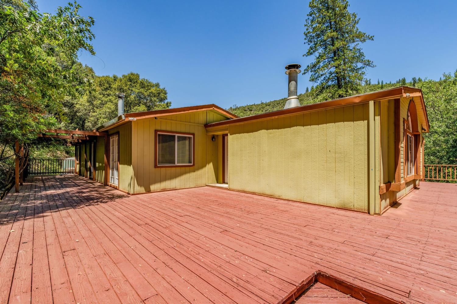 16000 Sutter Creek Road Sutter Creek, CA 95685 - Photo 39 of 80 a view of a house with a wooden deck