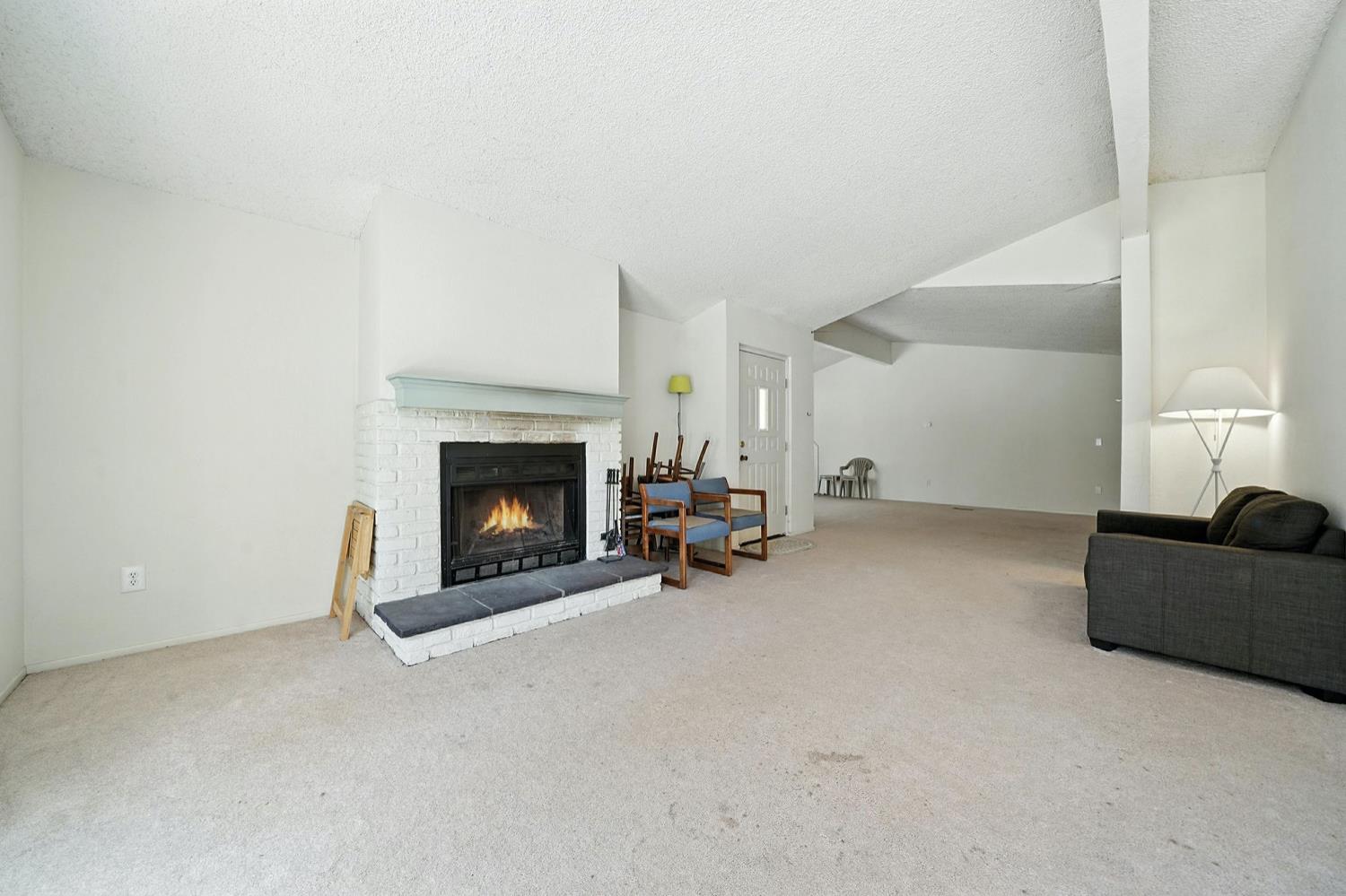 16000 Sutter Creek Road Sutter Creek, CA 95685 - Photo 5 of 80 a living room with furniture and a fireplace