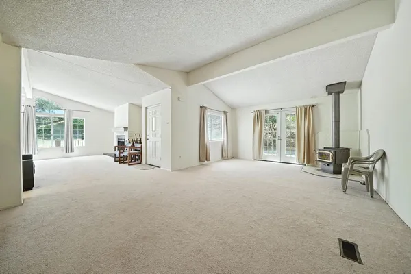 a bedroom with two beds and a chandelier
