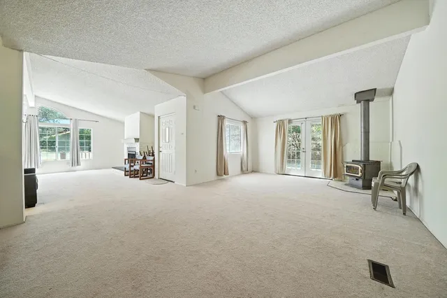 a bedroom with two beds and a chandelier
