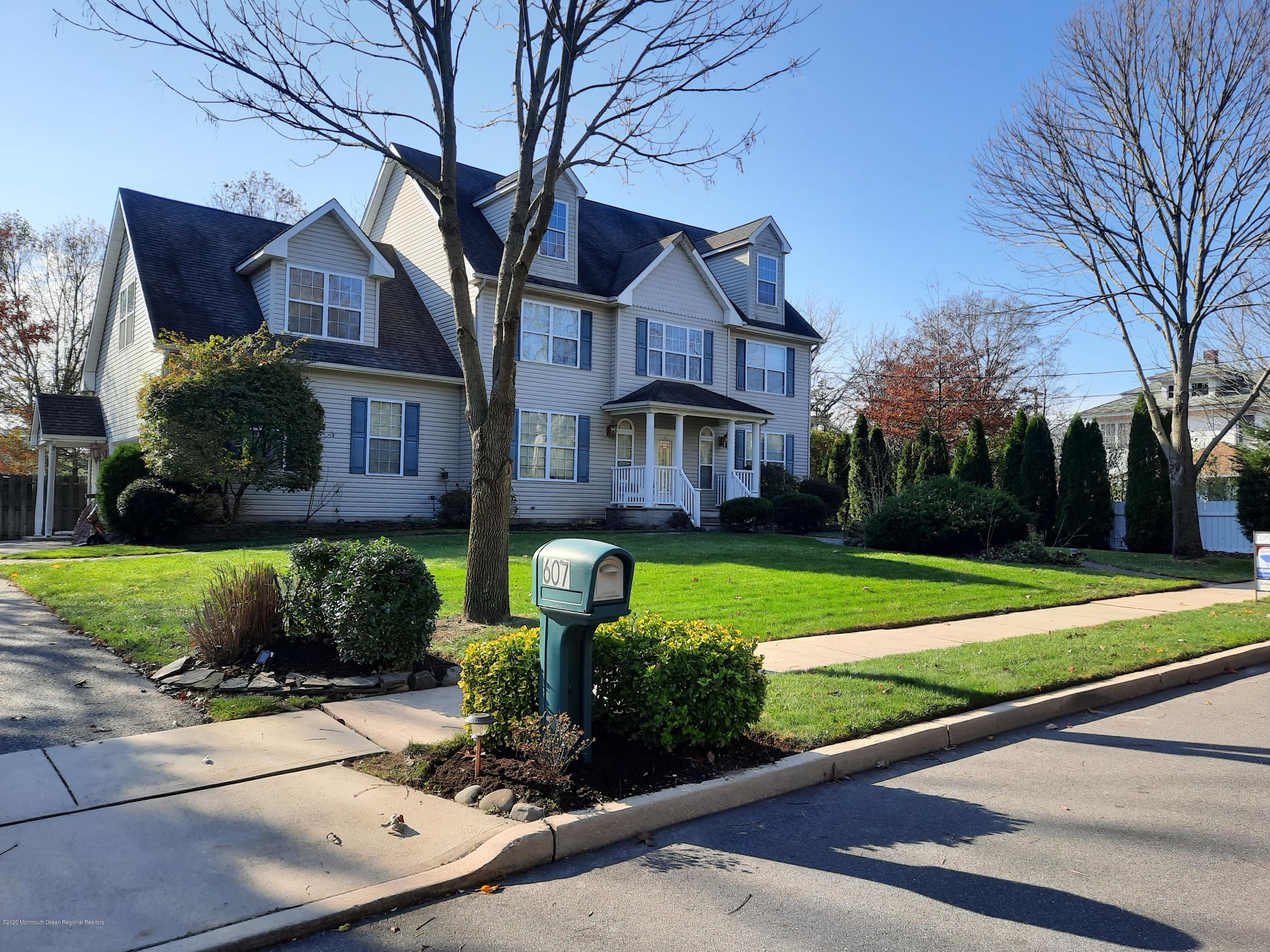 607 Dave Marion Road Toms River, NJ 08753 - Photo 1 of 9 a front view of a house with a yard