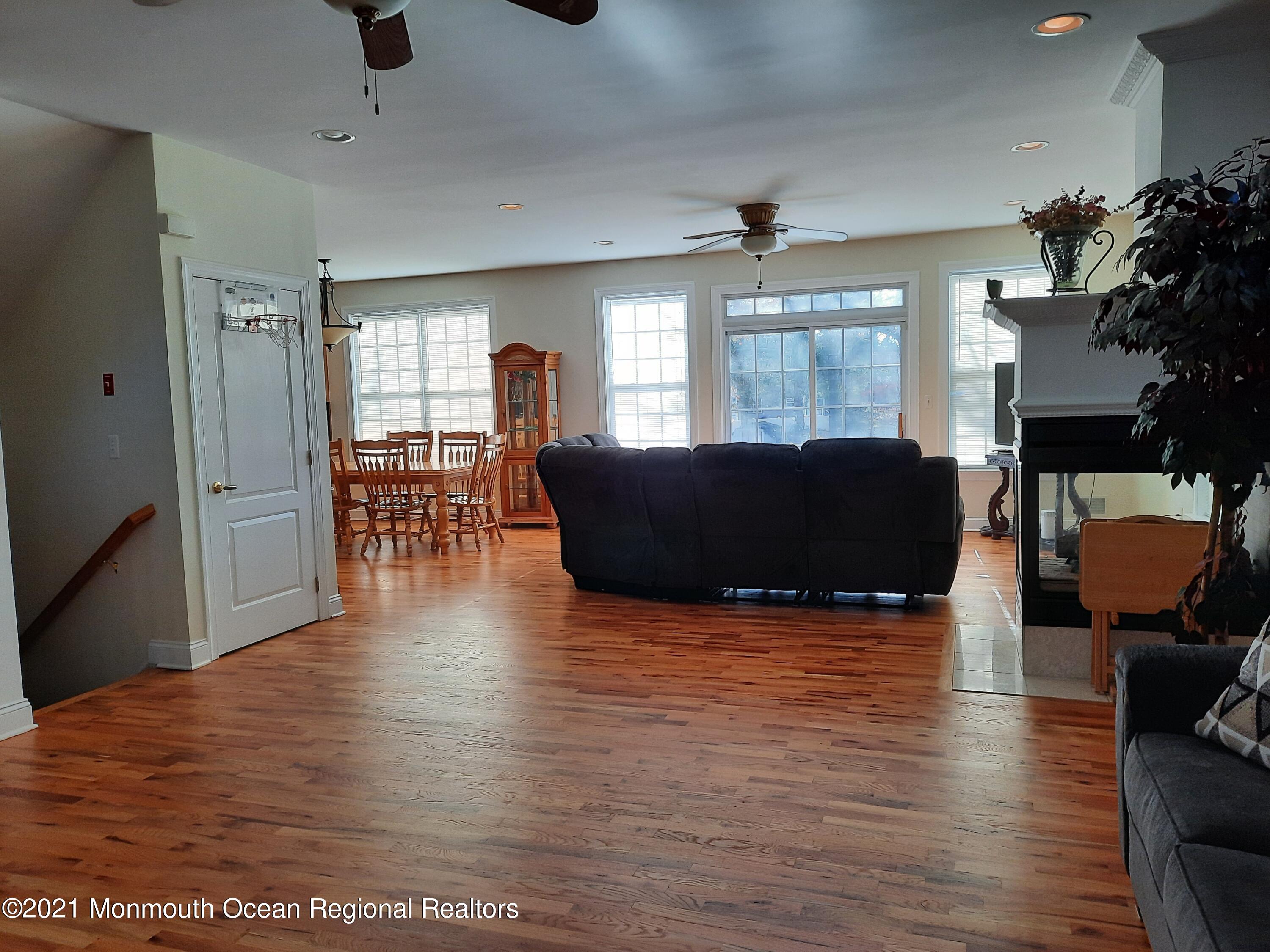 607 Dave Marion Road Toms River, NJ 08753 - Photo 4 of 9 a view of a livingroom with furniture window and wooden floor
