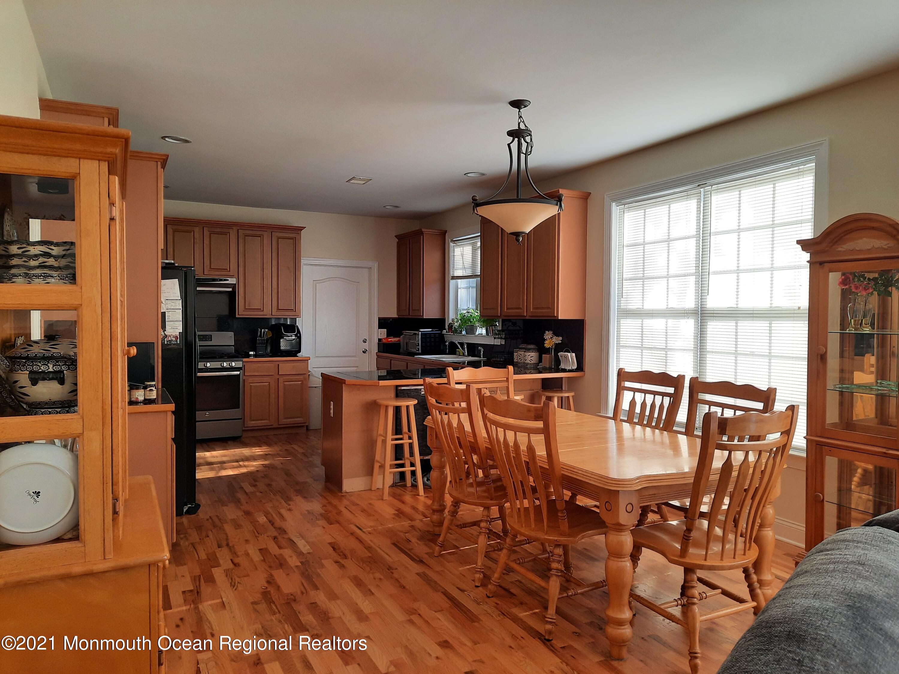 607 Dave Marion Road Toms River, NJ 08753 - Photo 7 of 9 a view of a dining room with furniture window and wooden floor
