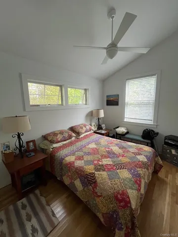 a bedroom with a bed and window