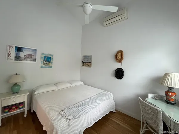 a bedroom with a bed and a table in it