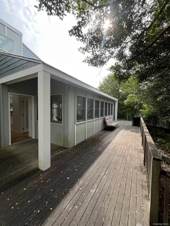 a view of house with a deck