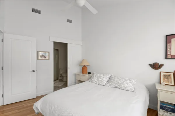 a bedroom with a bed and a table