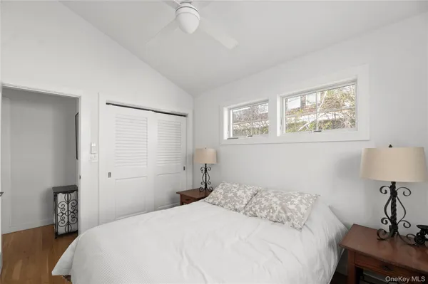 a bedroom with a bed and a table in it
