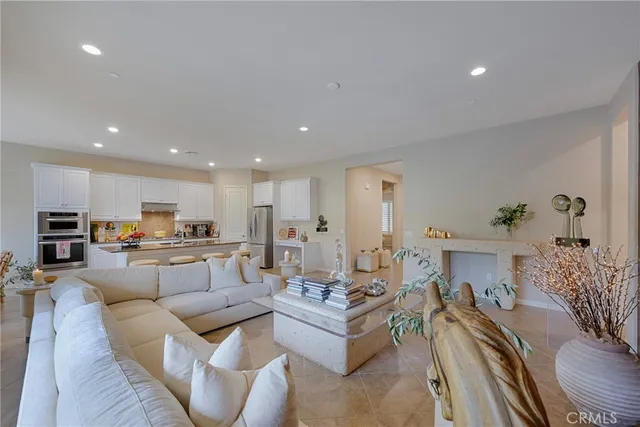 a bedroom with furniture and a flat screen tv