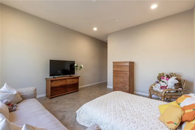 a spacious bathroom with a tub sink and mirror