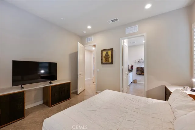 a view of a swimming pool with a chairs in a patio