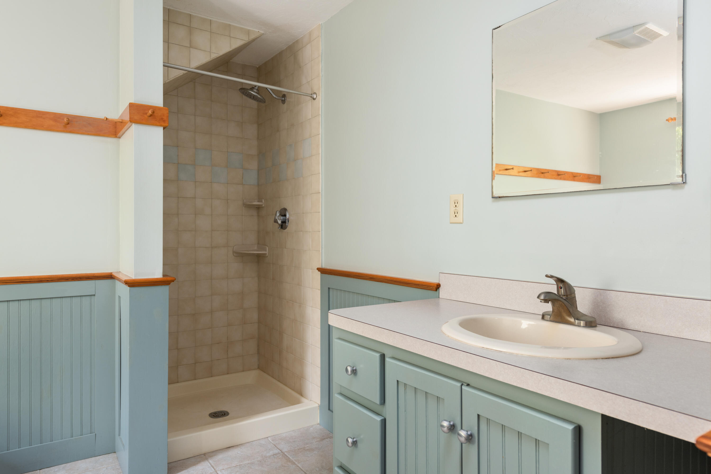 305 Monomoscoy Road Mashpee, MA 02649 - Photo 26 of 49 a bathroom with a sink and a mirror