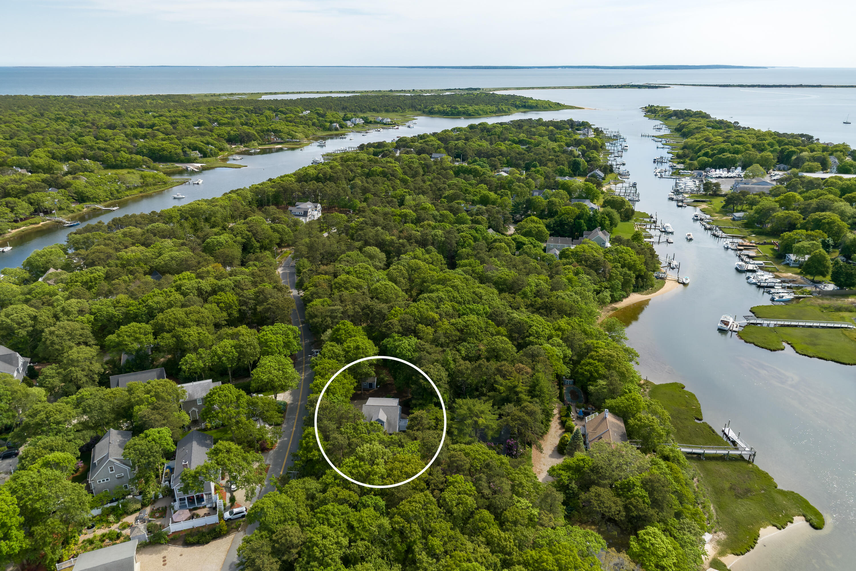 305 Monomoscoy Road Mashpee, MA 02649 - Photo 44 of 49 a aerial view of a house with a lake view